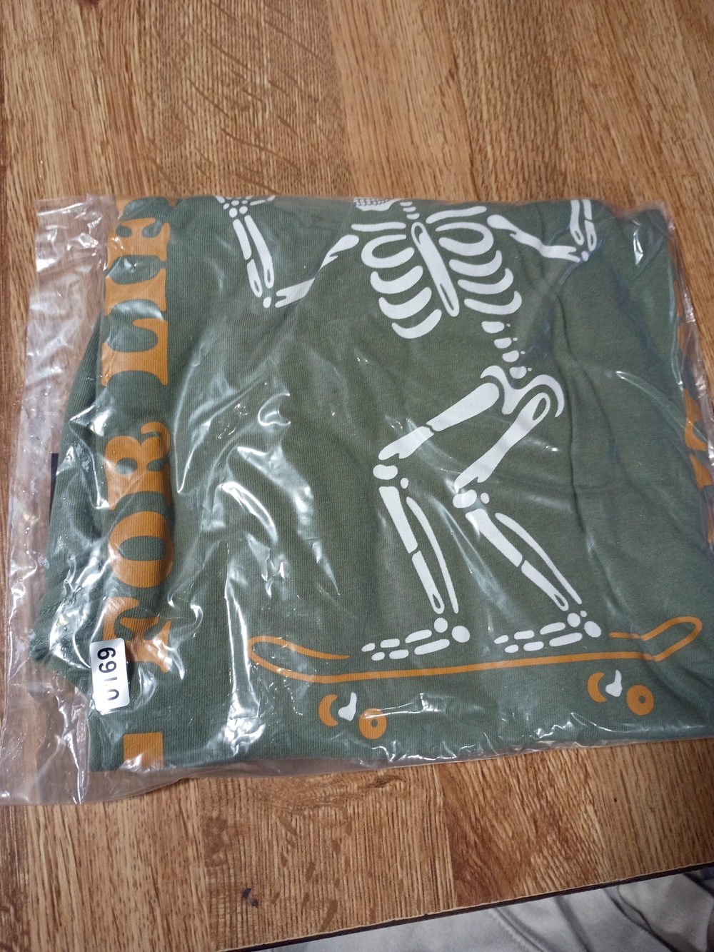 wonder nation Olive Long Sleeve Tee with White Skeleton & Orange Skate Graphic